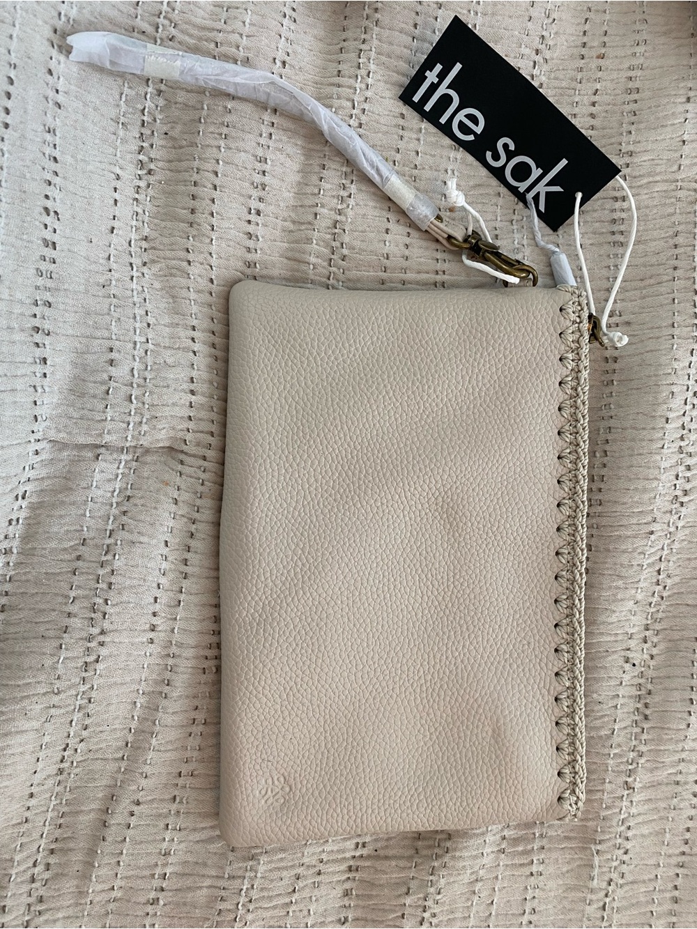 The Sak Pebbled Leather Wristlet in Cream